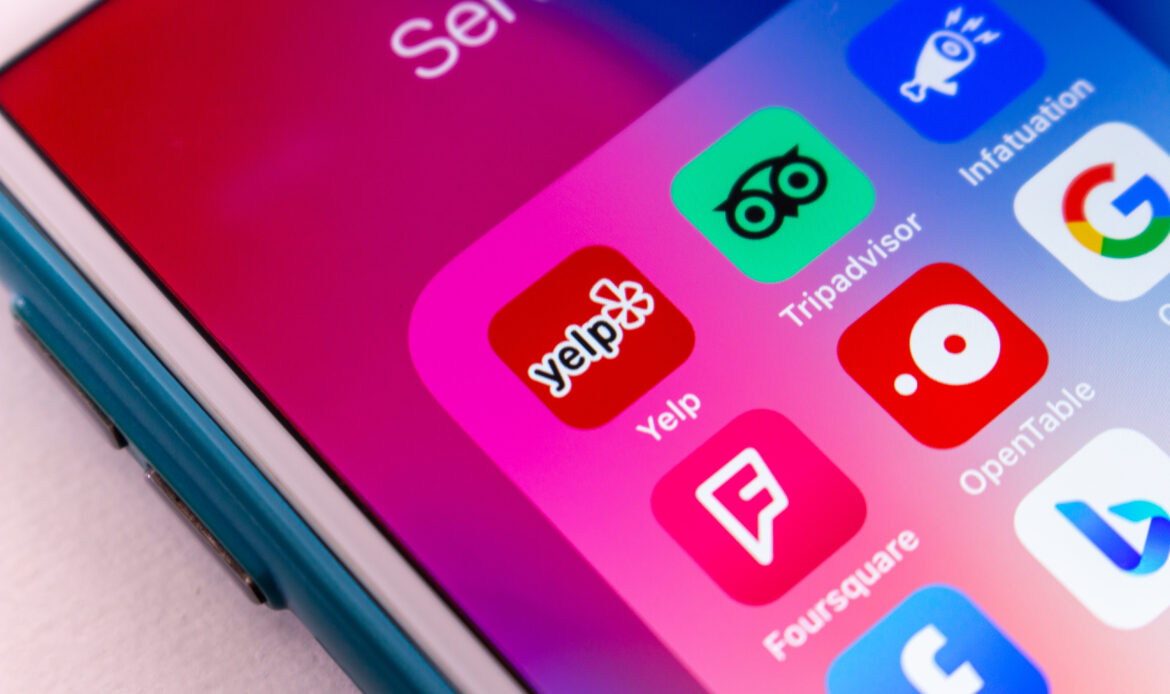 Phone open to show apps including Yelp, Google, and Facebook to perform competitor analysis